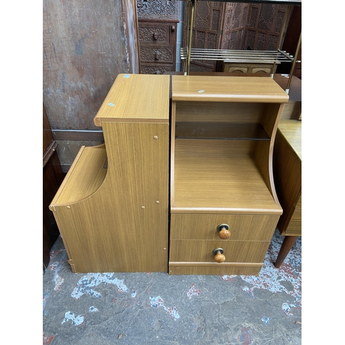 60 - A pair of teak effect two drawer bedside cabinets - approx. 83cm high x 44cm wide x 47cm deep