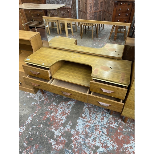 61 - A mid 20th century teak effect dressing table - approx. 106cm high x 120cm wide x 43cm deep