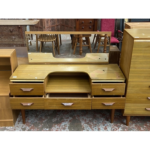 61 - A mid 20th century teak effect dressing table - approx. 106cm high x 120cm wide x 43cm deep