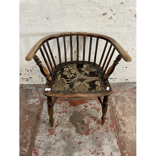 63 - A late 19th century elm spindle back elbow chair with fabric upholstered seat - approx. 72cm high x ... 