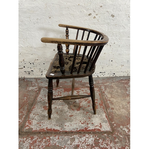 63 - A late 19th century elm spindle back elbow chair with fabric upholstered seat - approx. 72cm high x ... 