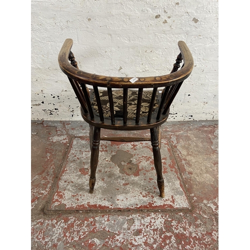 63 - A late 19th century elm spindle back elbow chair with fabric upholstered seat - approx. 72cm high x ... 