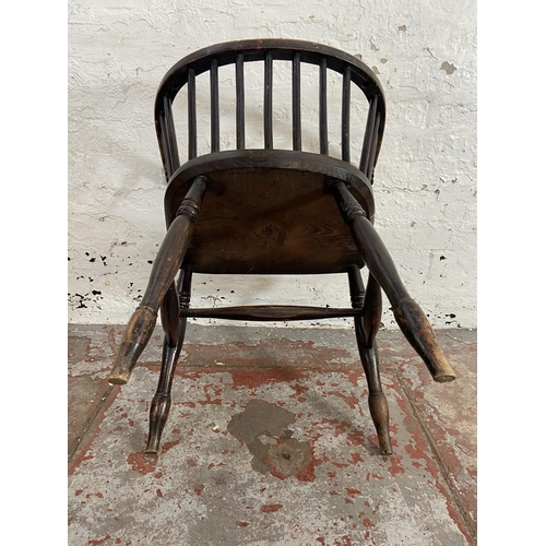 63 - A late 19th century elm spindle back elbow chair with fabric upholstered seat - approx. 72cm high x ... 