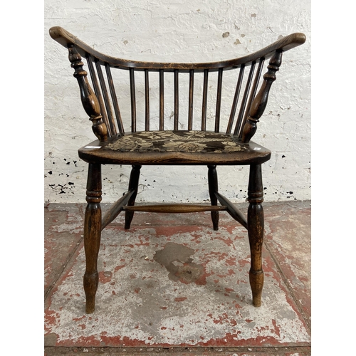 63 - A late 19th century elm spindle back elbow chair with fabric upholstered seat - approx. 72cm high x ... 