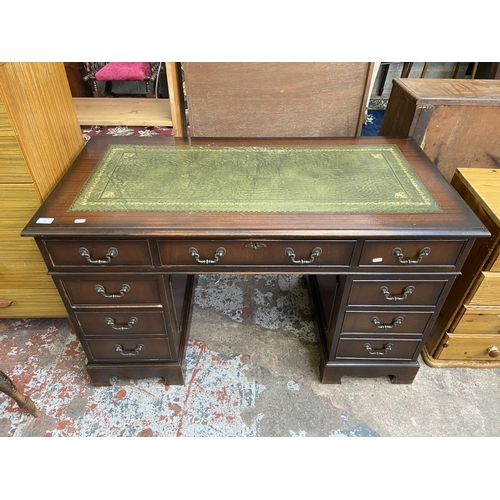 64 - A 19th century style mahogany and green leather pedestal writing desk - approx. 75cm high x 122cm x ... 