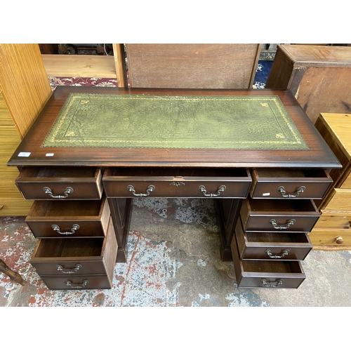 64 - A 19th century style mahogany and green leather pedestal writing desk - approx. 75cm high x 122cm x ... 