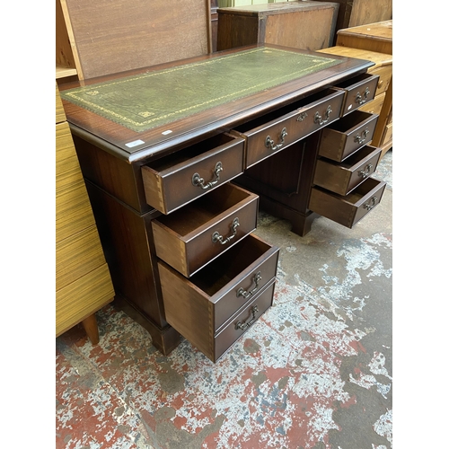 64 - A 19th century style mahogany and green leather pedestal writing desk - approx. 75cm high x 122cm x ... 