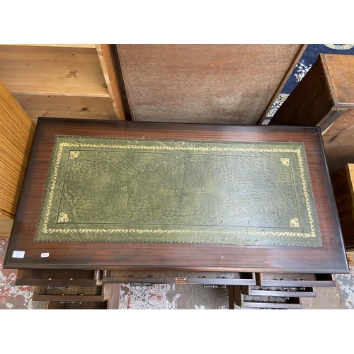 64 - A 19th century style mahogany and green leather pedestal writing desk - approx. 75cm high x 122cm x ... 