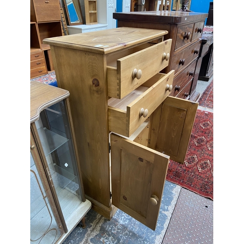 68 - A modern solid pine two door cabinet - approx. 116cm high x 74cm wide x 35cm deep