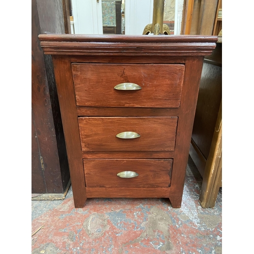 73 - A modern stained hardwood bedside chest of drawers - approx. 61cm high x 45cm wide x 40cm deep