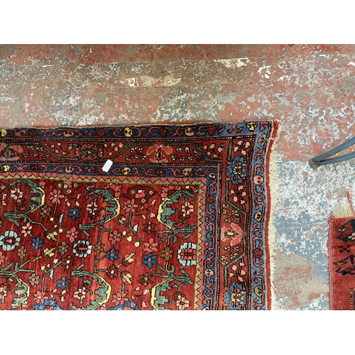 75 - A late 19th/early 20th century Persian hand knotted rug - approx. 162cm x 110cm