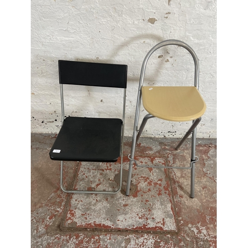 77 - Two modern folding chairs