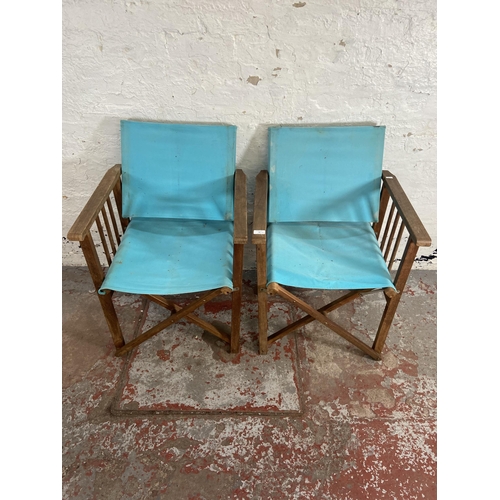 79 - A pair of teak and pale blue fabric director's chairs