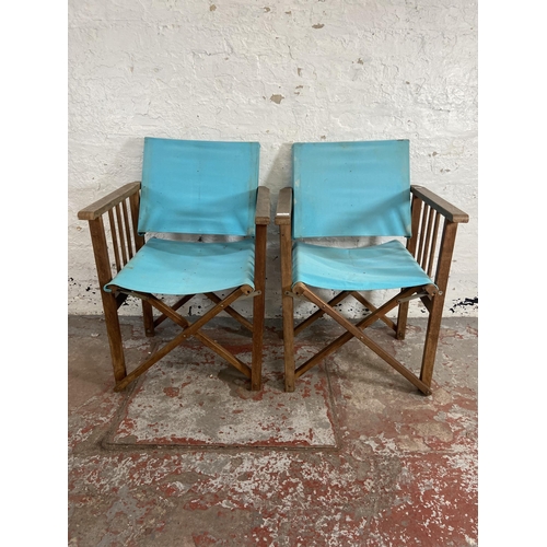 79 - A pair of teak and pale blue fabric director's chairs