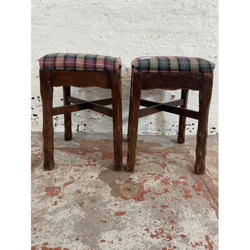 81 - A pair of stained beech and tartan fabric upholstered stools - approx. 47cm high x 31cm wide x 31cm ... 