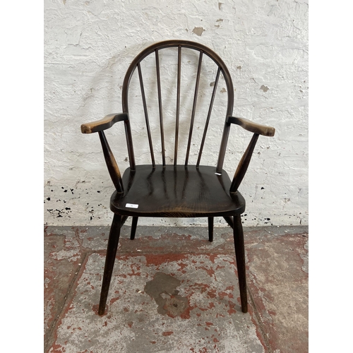 82 - A mid 20th century Ercol style elm and beech armchair