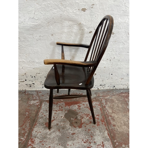 82 - A mid 20th century Ercol style elm and beech armchair