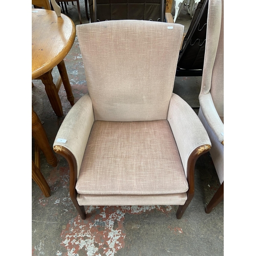 84 - A mid 20th century Parker Knoll PK749-1014 beech and fabric upholstered armchair