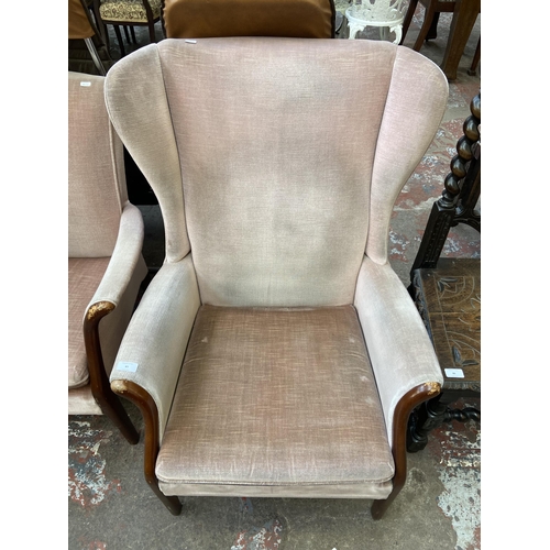 85 - A mid 20th century Parker Knoll PK750 beech and fabric upholstered wingback armchair