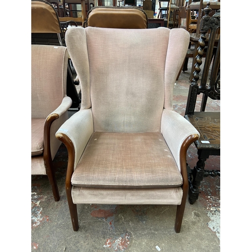 85 - A mid 20th century Parker Knoll PK750 beech and fabric upholstered wingback armchair