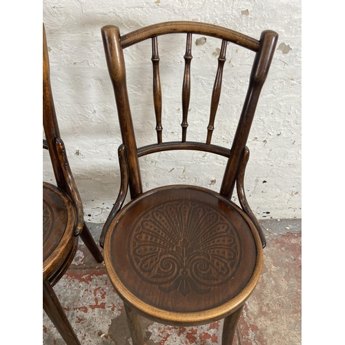 89 - A pair of early 20th century Thonet style bentwood bistro chairs with embossed seats