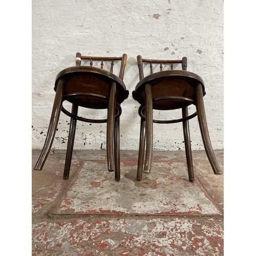 89 - A pair of early 20th century Thonet style bentwood bistro chairs with embossed seats