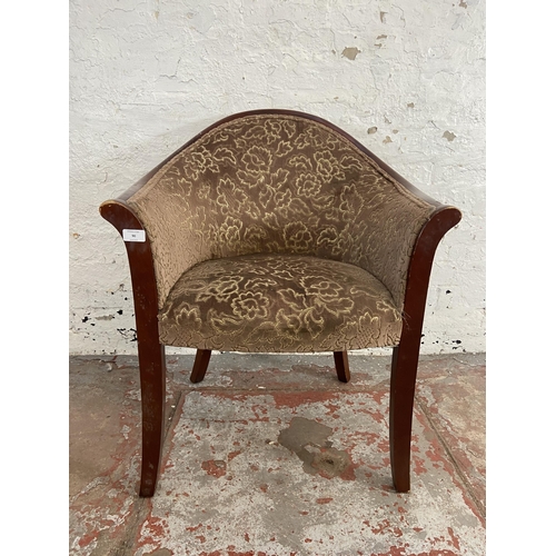 90 - A mid 20th century Parker Knoll PK1184-7 stained beech and floral fabric upholstered armchair