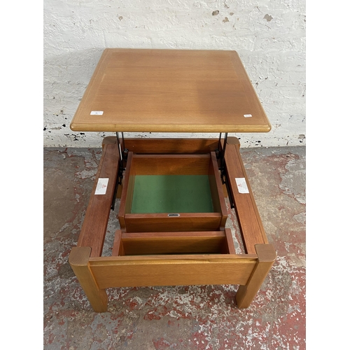 91 - A Nathan teak metamorphic coffee table - approx. 41cm high x 63cm wide x 63cm deep