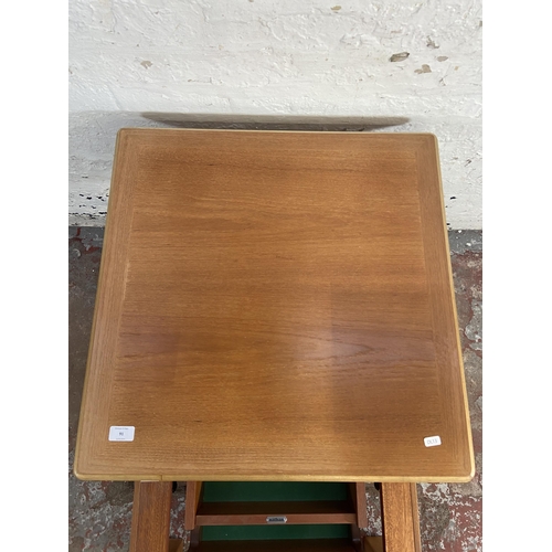 91 - A Nathan teak metamorphic coffee table - approx. 41cm high x 63cm wide x 63cm deep