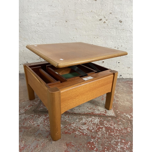 91 - A Nathan teak metamorphic coffee table - approx. 41cm high x 63cm wide x 63cm deep