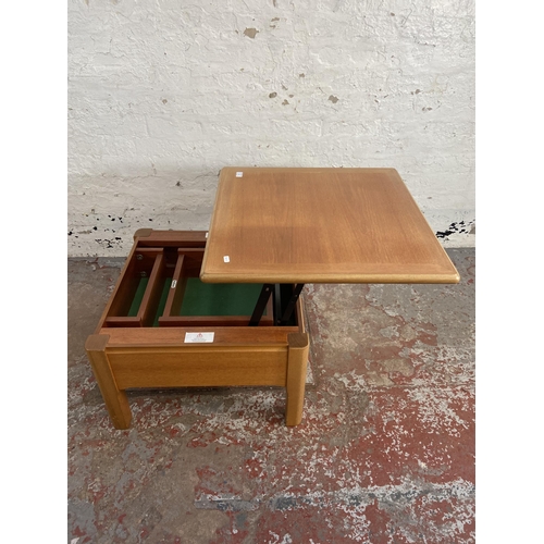 91 - A Nathan teak metamorphic coffee table - approx. 41cm high x 63cm wide x 63cm deep