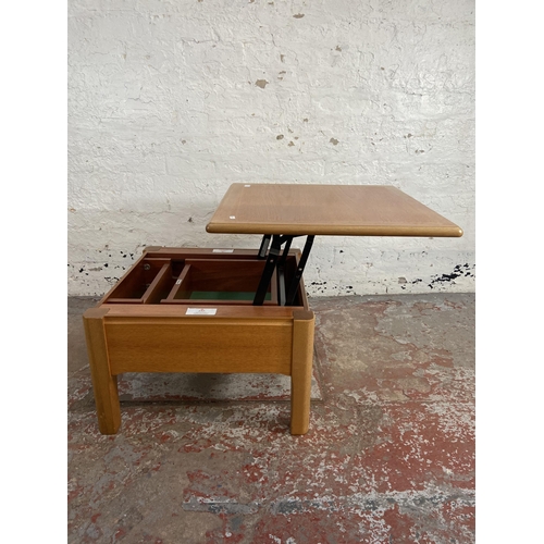 91 - A Nathan teak metamorphic coffee table - approx. 41cm high x 63cm wide x 63cm deep