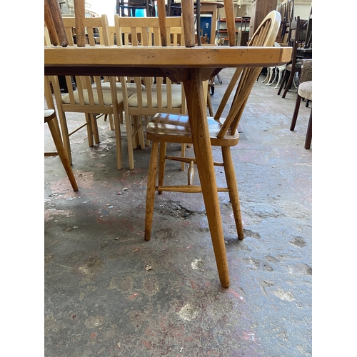 92 - A mid 20th century bespoke oak and beech dining table and four Ercol style elm and beech dining chai... 