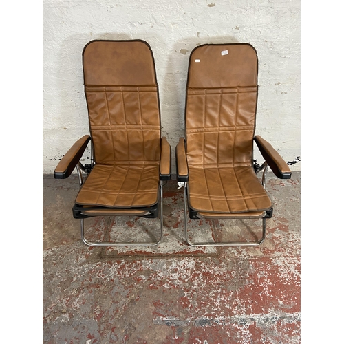 97A - A pair of Italian Maule Marga style brown faux leather and metal reclining armchairs/loungers