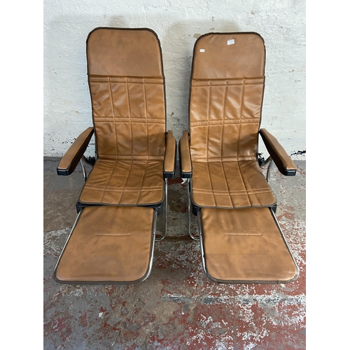 97A - A pair of Italian Maule Marga style brown faux leather and metal reclining armchairs/loungers