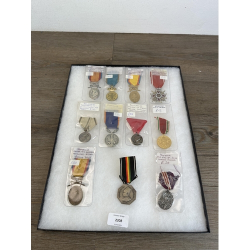 2308 - A collection of Romanian and Bulgarian medals to include Ferdinand I Silver Medal For Bravery, Medal... 