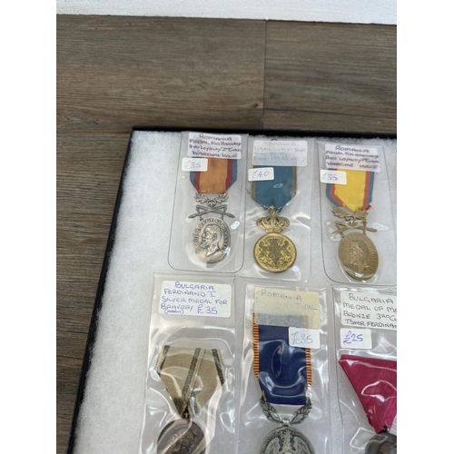 2308 - A collection of Romanian and Bulgarian medals to include Ferdinand I Silver Medal For Bravery, Medal... 