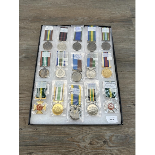 2309 - A collection of South African military medals to include Homeland Army Soldiers, Homeland Gallantry ... 