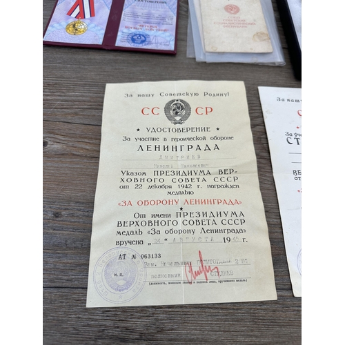 2310 - A collection of Russian military medals and paperwork to include The Order of Glory 3rd Class, 1930s... 