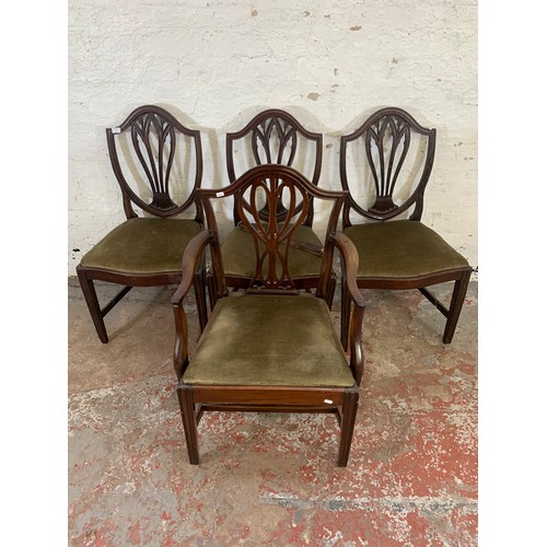 97 - Four 19th century Hepplewhite style mahogany shield back chairs, three dining and one carver