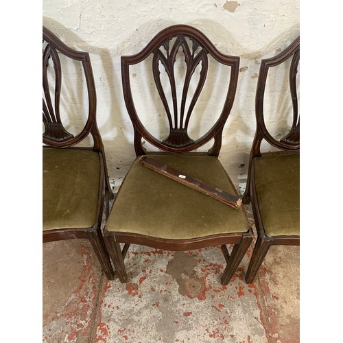 97 - Four 19th century Hepplewhite style mahogany shield back chairs, three dining and one carver