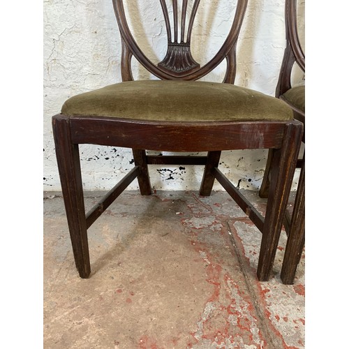 97 - Four 19th century Hepplewhite style mahogany shield back chairs, three dining and one carver