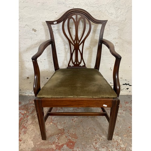 97 - Four 19th century Hepplewhite style mahogany shield back chairs, three dining and one carver