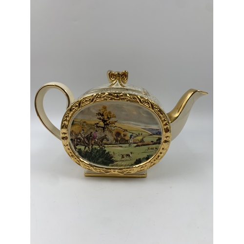 311 - A Sadler No. 1763 barrel shaped hunting scene three piece tea set