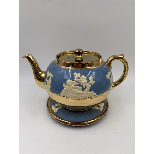 314 - A Gibsons Blue Jasperware and gilt four piece tea set