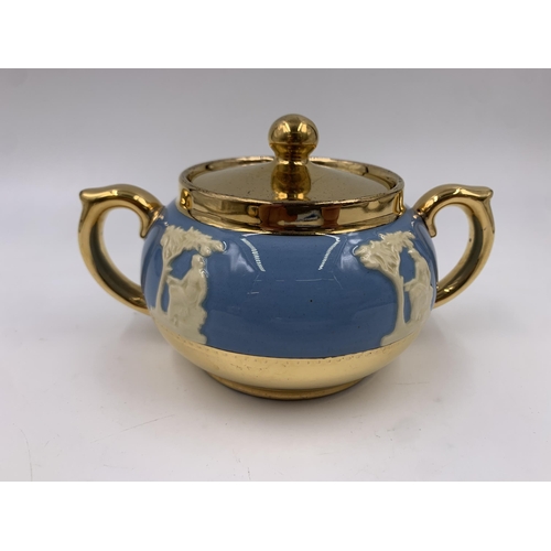 314 - A Gibsons Blue Jasperware and gilt four piece tea set