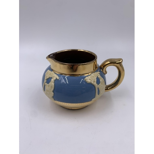 314 - A Gibsons Blue Jasperware and gilt four piece tea set