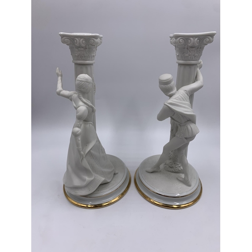 328 - A pair of 1986 The Franklin Mint The Romeo and Juliet fine porcelain candlesticks - approx. 25cm hig... 