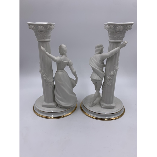 328 - A pair of 1986 The Franklin Mint The Romeo and Juliet fine porcelain candlesticks - approx. 25cm hig... 