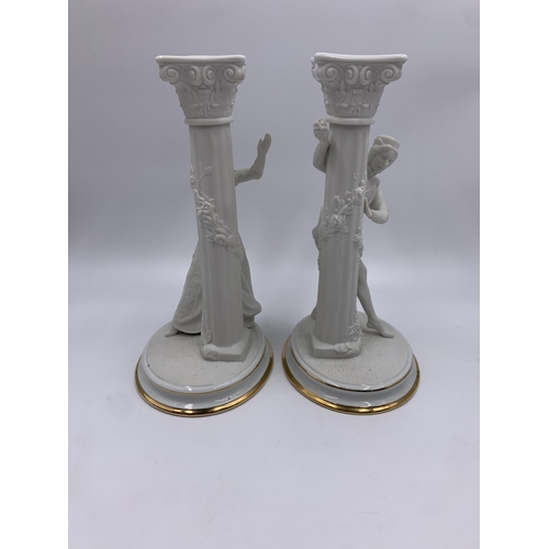 328 - A pair of 1986 The Franklin Mint The Romeo and Juliet fine porcelain candlesticks - approx. 25cm hig... 